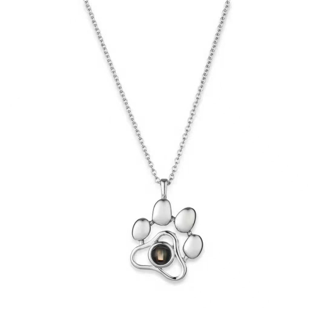 Trendy and fashionable dog paw print projection necklace