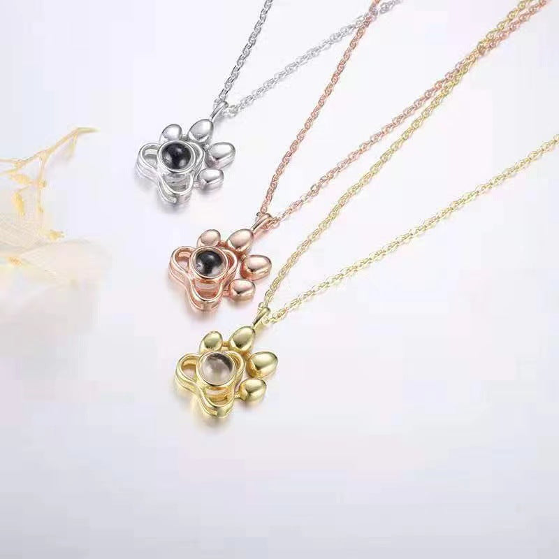 Trendy and fashionable dog paw print projection necklace